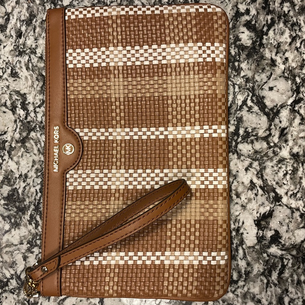 New Michael Kors clutch/wristlet with original tags included.
